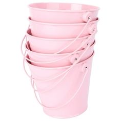 a stack of pink buckets sitting on top of each other