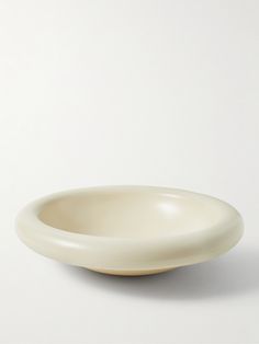 a white bowl sitting on top of a table