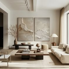 a living room with two paintings on the wall