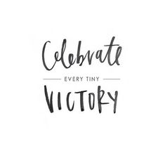 the words celebrate every tiny victory written in black ink