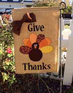 a sign that says give thanks with a turkey on it