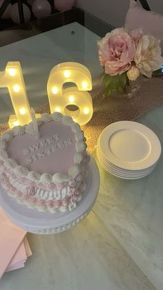 a heart shaped cake sitting on top of a table