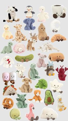 many different stuffed animals are arranged together