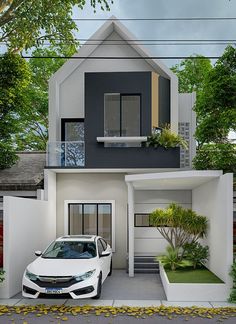 a white car is parked in front of a two story house with an attached balcony