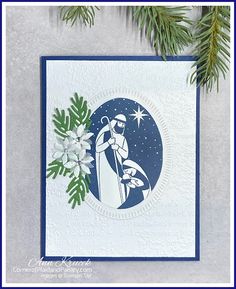 a handmade christmas card with an image of a man holding a baby in his arms