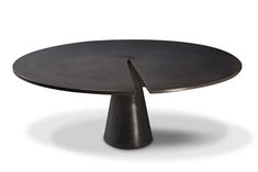 a black table with an unusual design on it's top and bottom, sitting in front of a white background