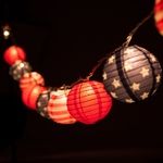 red, white and blue lanterns hanging from string