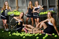 the girls are posing with tennis balls and rackets