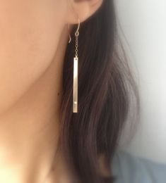 Simple and sleek, these lightweight gold diamond bar earrings are just gorgeous. So easy to wear with almost any outfit. Hand-formed 14k gold fill french hooks with 14k gold fill chain and bar. I flushed set a tiny diamond cz on the ends of each bar. 2 1/8 inches long from chain to bar. I provide two clear rubber backings with these earrings. If you would like a complete matching set, here are links to matching necklaces and a bracelet: Necklaces - 1) https://www.etsy.com/listing/192922687/horiz Minimalist Linear Earrings For Formal Occasions, Modern 14k Gold Everyday Linear Earrings, Sleek Simple Jewelry As Gift, Sleek Simple Jewelry Gift, Sleek Single Earring Jewelry For Gift, Minimalist Diamond Drop Earrings, Sleek Earrings For Gift, Minimalist Diamond Earrings For Everyday, Minimalist Formal Diamond Drop Earrings