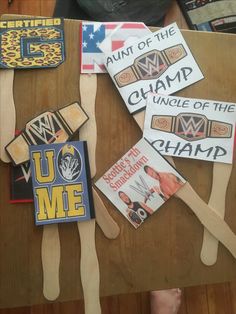 wooden utensils with stickers on them sitting on top of a wood table