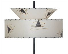 two lamps with black and white designs on them