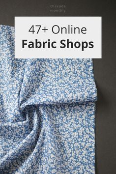 a blue and white flowered fabric with the words 47 online fabric shops on it