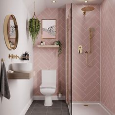 a bathroom with pink wallpaper and gold accents