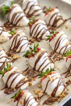 chocolate covered strawberries are arranged on a baking sheet