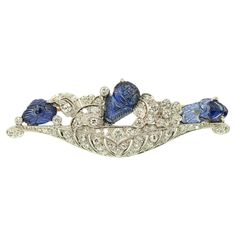 Stunning Art Deco sapphire diamond brooch by Wise (Williams Wise & Son) with 3 natural carved sapphire and 58 brilliant cut and single cut diamonds approximate 2.00 cts H-I color VS2 clarity finely crafted in Platinum Approximate Weight: Gross - 14.80 grams Diamonds ~ 2.0 carats Approximate Measurement: Overall - 57.1mm x 19.3mm (2.25 x 0.76 inches) Hallmarks: WISE, PLAT 7795, 14K Sapphire Brooch, Brooch Art, Hermes Kelly Bag, Slim Aarons, Cartier Panthere, 1930s Art, Floral Brooch, Bracelet Love, Diamond Brooch