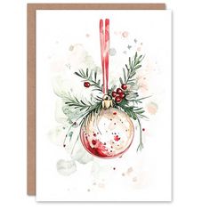 a christmas ornament with holly and red berries on it is hanging from a card