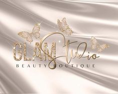 the logo for glam studio is shown in gold and silver with butterflies on it