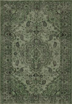 a green rug with an ornate design on the center and sides, in various colors