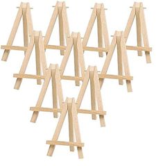 six wooden eases are lined up in the shape of an x on a white background