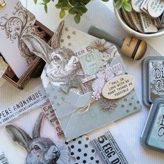 an assortment of stamps and cards on a table