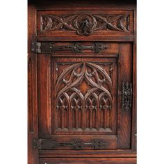 an old wooden cabinet with carvings on it