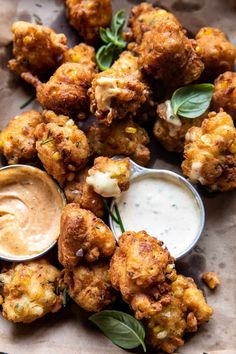 some fried food with dipping sauce on the side