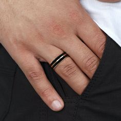 a close up of a person wearing a wedding ring