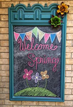 a chalkboard with the words welcome spring written on it