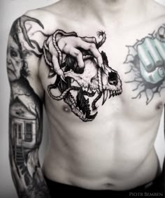 a man with some tattoos on his chest