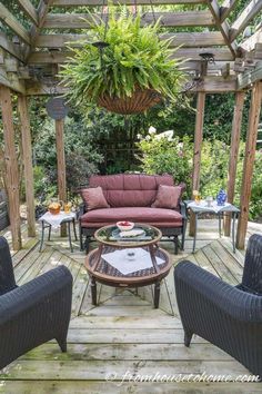 an outdoor living area with couches and chairs