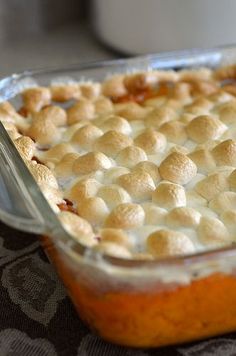 a casserole dish filled with marshmallows on top of a table