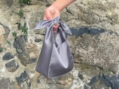 🔘 This Elegant Satin knot bag is ideal for the wedding day, night out, party, special occasion, brides, bridesmaids, mothers of the bride, or any formal fun 🔘 This  bag has an elastic opening and a stiff bottom   🔘 Please contact us for a custom order. 🔘 Material: Satin fabric or faux Silk. The lining fabric is the same fabric as on the outside. This bag has a magnetic snap closure inside. It also has a bottom shaper inside. 🔘 Measurements: Bottom Length x Height x Depth; 16 x 16 x 10 cm / Rectangular Satin Wedding Bag, Elegant Rectangular Bag For Bridesmaid Gift, Elegant Rectangular Bridesmaid Gift Bag, Furoshiki Bag, Japanese Knot, Satin Purses, Japanese Knot Bag, Knot Bag, Bride Bag