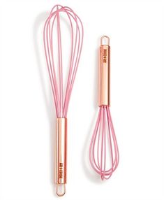 a pink whisk is next to an empty whisk on a white background