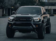 the front end of a black toyota truck