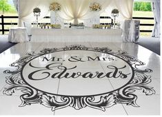 a white dance floor with the words mr and mrs engraved on it