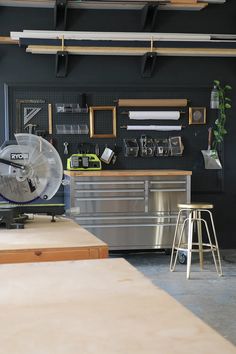 an industrial kitchen with metal workbench and tools