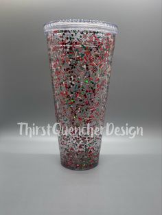 a cup filled with confetti and sprinkles