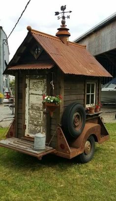 an old truck with a little house on the back