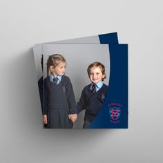 two children's school uniforms are shown on the front and back of this brochure