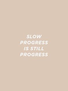 the words slow progress is still progress written in white on a beige background with an orange and