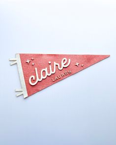 a red and white pennant with the name jane laury on it's side