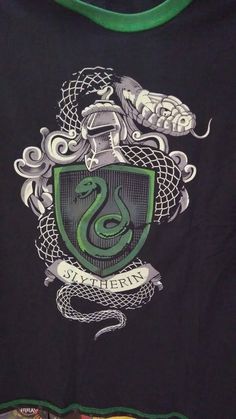 a green and black shirt with a snake on it