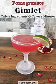 pomegranate gimlet in a coupe glass with garnishes