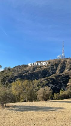 the hollywood sign is on top of a hill