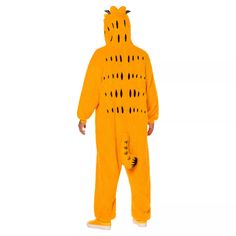 a man in a yellow bear costume is standing with his back turned to the camera