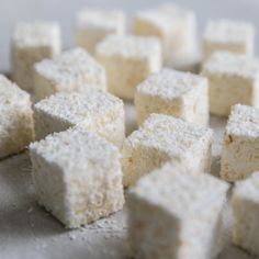 there are many small pieces of food on the counter top, and one is cut into cubes