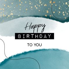 a happy birthday card with gold confetti on blue watercolor paper and the words, happy birthday to you