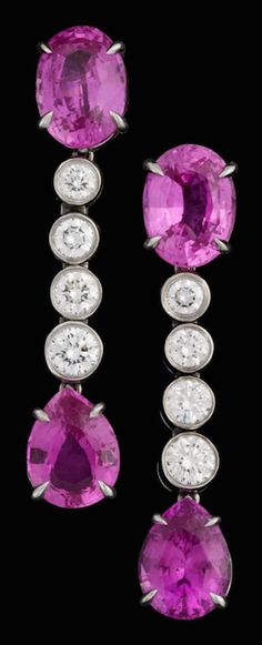 Lady's platinum and diamond pink sapphire drop earrings, Bvlgari Oval cut pink sapphire followed by four graduated collet set round brilliant cut diamonds finishing in a single pear shaped pink sapphire drop, signed by the maker, French omega post backing, accompanied by original box. Earrings Bvlgari, Bulgari Earrings, Mystic Jewelry, Sapphire Drop Earrings, Bulgari Jewelry, Mystical Jewelry, Fantasy Closet, Sapphire Pendant