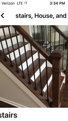 a wooden stair case next to a glass door