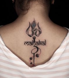 a woman with a tattoo on her back neck